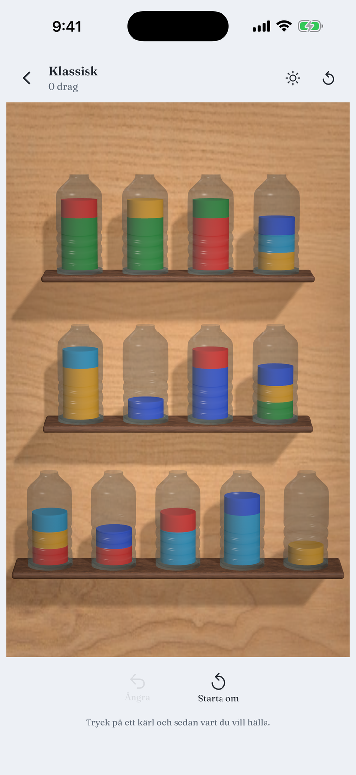 A board of glass vessels filled with layered colour